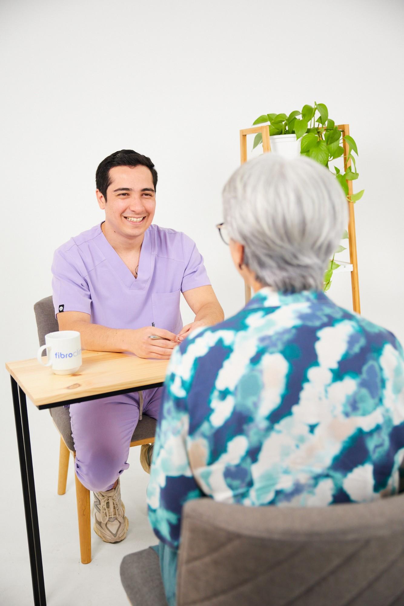 Consultation at Fibroclinic: a clinician talking with a patient
